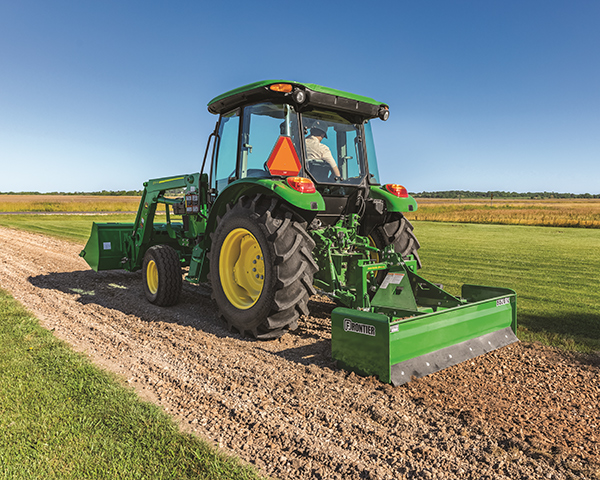 John Deere 5 Series utility tractor pulling a box blade